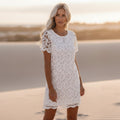 Women's lace overlay mini dress in white - front