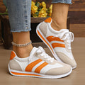 Men's lace-up low-top sneakers in orange